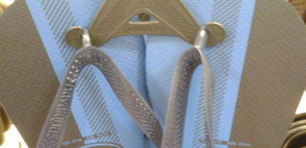 Black and blue flip flops